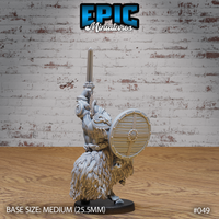 Dwarven goat centaur gripping a longsword raised skyward, shield arm extended, scrollwork shoulder armour visible, dense layered fur across the goat lower body, plain oval base. Sculpt by Epic Miniatures.