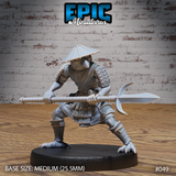 Kenku warrior in a low braced stance, gripping a long glaive horizontally at waist height. Wears lamellar shoulder armour, belted robes, riveted greaves, and a wide conical hat. Clawed feet splayed wide. Sculpt by Epic Miniatures.
