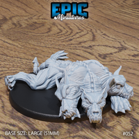 Flayed three-headed cerberus miniature lying prone, all three horned heads resting low on the ground, teeth parted, with exposed musculature and ribcage detail. Large oval base. Epic Miniatures sculpt.