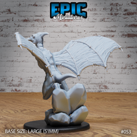 Pterafolk sculpt viewed from behind, wings outstretched with detailed membrane vein structure, horned head turned to one side, crouched on a chunky rock formation base. Sculpt by Epic Miniatures.