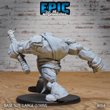 Stone golem viewed from behind and side, torso pitched low in a charging stance, club raised in one hand with skull ornaments visible along its length. Deep angular rock texture covers the shoulders and legs with a tattered sash across the back. Sculpt by Epic Miniatures.