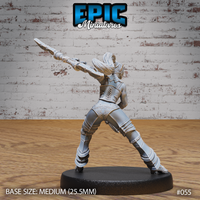 Dark elf female gladiator seen from behind, staff extended overhead, showing a laced corset back panel, flowing hair, and scrollwork-detailed armour across the legs and torso. Sculpt by Epic Miniatures.