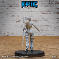Female dark elf gladiator seen from behind, long hair falling over shoulders, laced corset back piece and detailed leg armour visible, ornate staff held at her side. Plain oval base. Sculpt by Epic Miniatures.