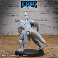 Alligator folk shaman viewed from behind, showing a thick scaled tail, rope-bound torso, crossed staff strapped to the back, and a rope-knotted topknot rising from the crown. Sculpt by Epic Miniatures.