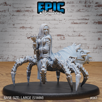 Drider Folk Priestess by Epic Miniatures — pale-haired woman seated on a large eight-legged spider body, raising a goblet in one hand, wearing draped robes, with a spined arachnid abdomen behind her. On a 51mm oval base.