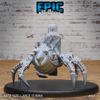 Drider Folk Priestess by Epic Miniatures — rear view showing the heavily textured, spike-covered spider abdomen and the back of long pale hair falling over the figure's shoulders. The eight serrated legs are splayed outward. On a 51mm oval base.