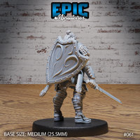 Hobgoblin warrior with a large ornately engraved kite shield raised across his body, sword held low in a defensive stance, wearing reinforced leather-wrapped boots and layered armour. Sculpt by Epic Miniatures.