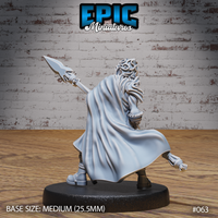 Elven spearman seen from behind, spear extended outward at an angle, large billowing cloak with smooth flowing folds dominating the silhouette, intricate knotwork visible on the back of the head wrap. Sculpt by Epic Miniatures.