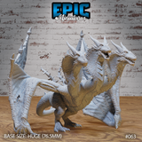 Three-headed wyvern miniature standing upright, wings spread wide, three horned heads angling outward with jaws open, covered in overlapping scales and dorsal spines. Sculpt by Epic Miniatures.