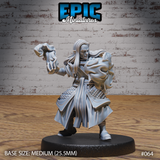Long-haired elven male figure in a flowing long coat over scale-mail skirts, twisting forward with one fist raised and wreathed in a churning cloud of conjured energy. Sculpt by Epic Miniatures.