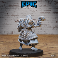 Elven male figure seen from behind, showing a billowing coat over braided scale-mail skirts, long hair streaming, one arm raised with a balled fist of swirling energy visible above the shoulder. Sculpt by Epic Miniatures.