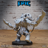 Orc gladiator with arms outstretched holding stone-bladed cleavers, a wide beast skull helmet with curved horns, chain-wrapped waist, spiked knuckle guards, and layered leather armour. Chains trail from the belt. Sculpt by Epic Miniatures.