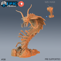 Digital render of an unpainted resin Adult Remorhaz miniature by Epic Miniatures — a huge-scale creature shown in a dramatic rearing pose, with a segmented spined body, dozens of clawed limbs, a single membrane wing, long curving horns, bulging compound eyes, and an open fanged maw with a sensory tendril, mounted on an integrated rocky rubble base; a small inset rear view and a blue d20 for scale are shown in the upper right corner