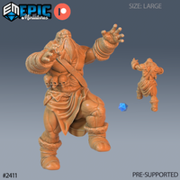 Digital render of the Snow Cyclops Attacking miniature by Epic Miniatures — a large, heavily muscled one-eyed giant with a long beard, grasping hand outstretched, skull sash across its chest, fur-trimmed bound boots, and flowing wrap, shown in pre-support orange resin render with a blue d20 for scale reference and a smaller rear-view of the sculpt