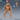 Digital render of an unpainted 32mm resin miniature of a muscular female northern tribes warrior in a ready fighting stance — fists raised and clenched, wearing a large fur-lined hood, fur-trimmed boots, layered leather armour with segmented waist plates, and a claw-tooth chest decoration. A side-view silhouette and a blue d20 scale reference die are visible in the background. Epic Miniatures sculpt #2419.