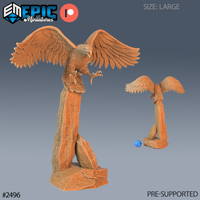 Large eagle-like roc fledgling perched atop a tall split rock pillar, wings fully spread and beak open mid-shriek, talons gripping stone. Sculpt by Epic Miniatures.