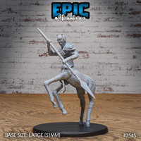 Giraffe centaur miniature rearing up with both hands gripping a long spear overhead, mouth open in a snarl, scaled lower body with bony studs, shoulder armour and spiky hair. Sculpt by Epic Miniatures.
