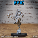 Female tribal warrior-mage striding forward, right hand raised with conjured magic at her fingers, left hand gripping a heavy axe. Long braided hair, layered bead necklaces, tattered skirt, cord-wrapped ankles. Rocky sculpted base. By Epic Miniatures.