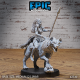 Tribal warrior woman with long dreadlocks, mouth open in a war cry, levelling a long spear while riding a snarling chained hyena. Sculpt by Epic Miniatures.