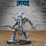 Muscular elephant-headed humanoid barbarian gripping a curved blade in each hand, with a spiked knuckleduster, wrapped bracers, scale belt, and flowing loincloth, on a large decorative oval base. Sculpt by Epic Miniatures.