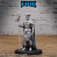 Muscular male tribal warrior standing upright, holding a tall feather-bound spear, wearing layered bead necklaces, a fringed wrap skirt, and a broad flowing cape. Feathered headdress atop rope-bound hair. Sculpt by Epic Miniatures.