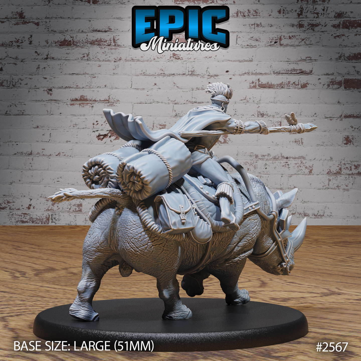 Rear view of a saddled war-rhino carrying a spear-armed rider, showing rolled bedrolls, leather saddlebags, rope lashing, and a quiver at the flank. Sculpt by Epic Miniatures.