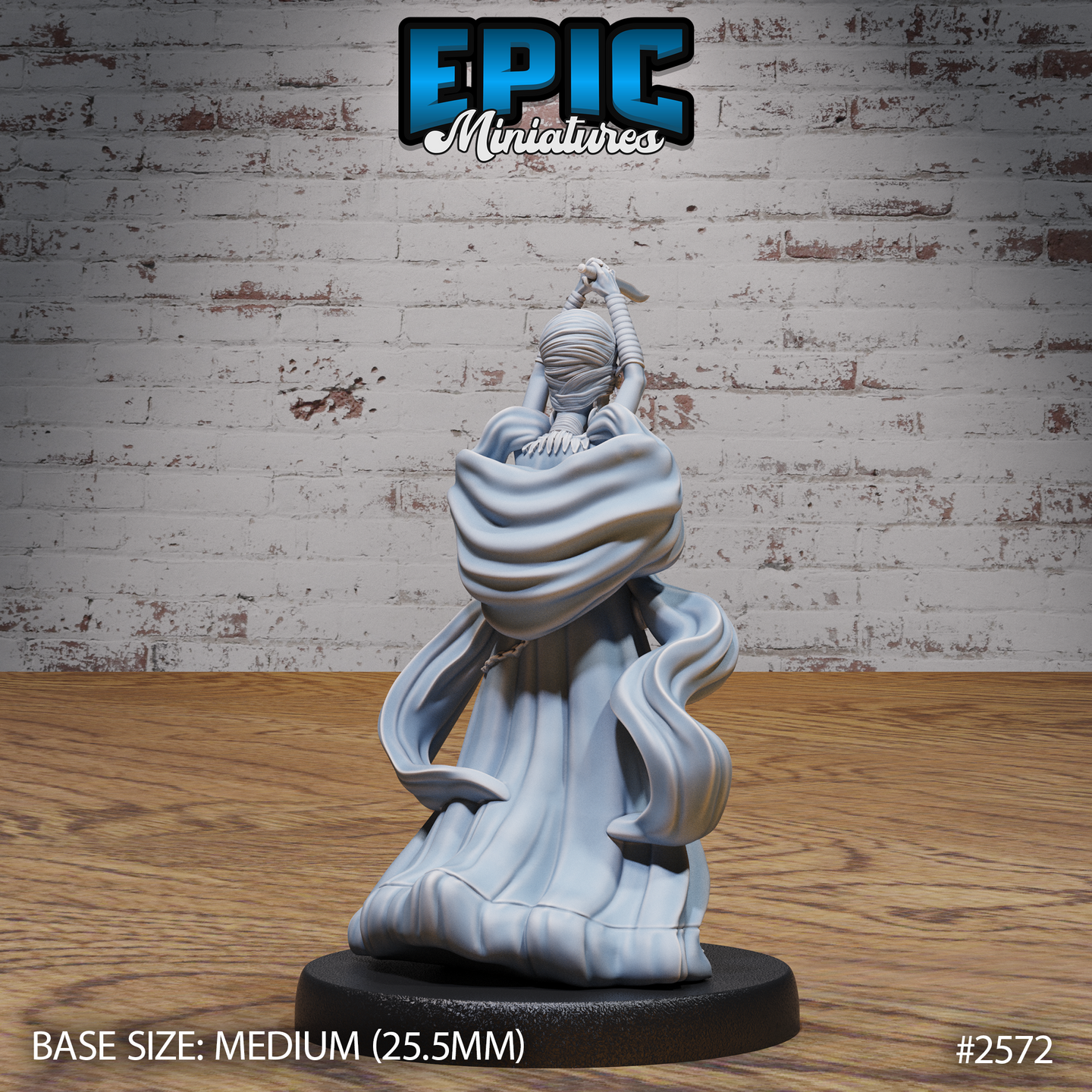 Rear view of a female spellcaster with arms raised gripping a dagger, wrapped headdress visible from behind, billowing cloak cascading down to a round plain base. Sculpt by Epic Miniatures.