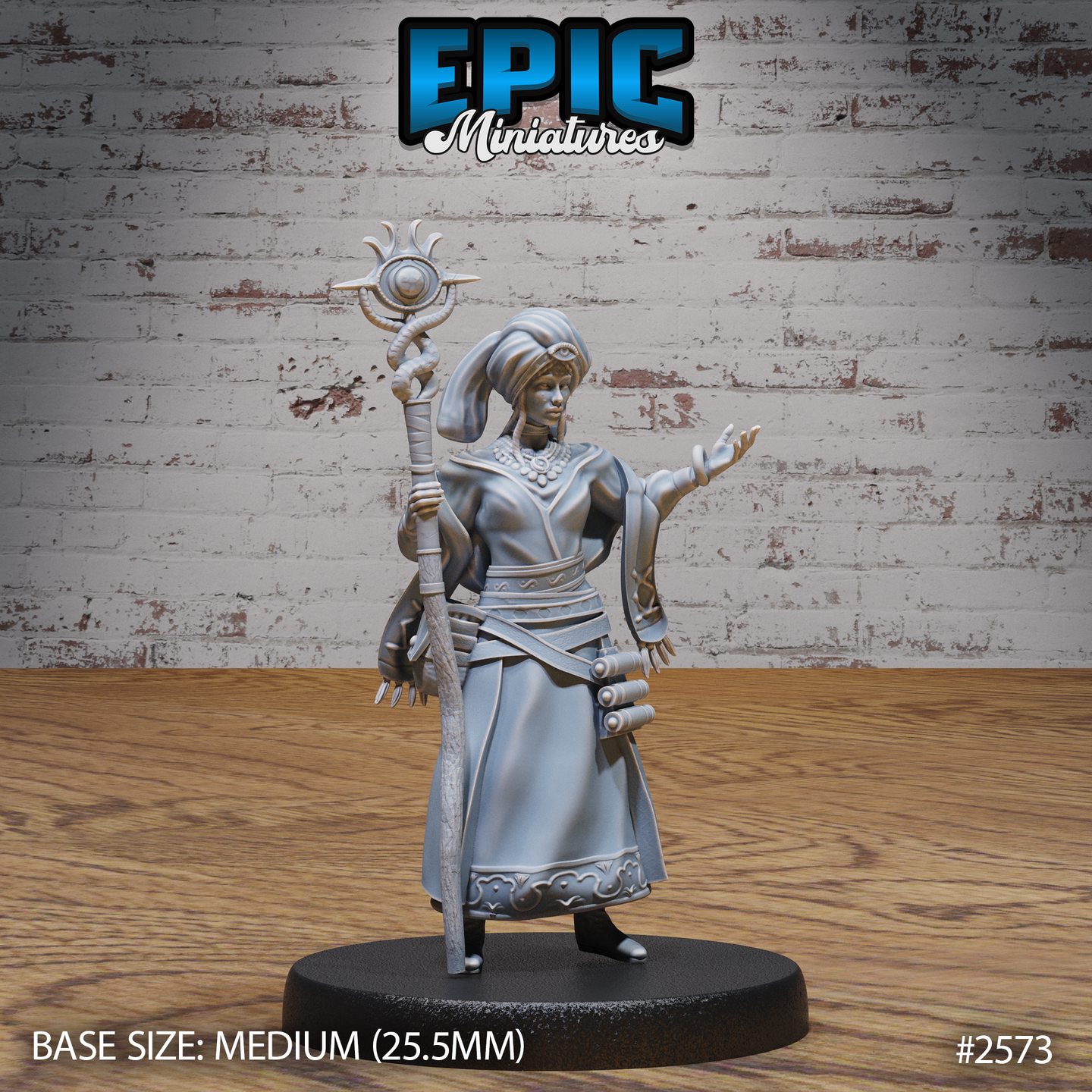 Female seer standing upright, raising a tall staff crowned with a spiked sun-orb totem, opposite arm extended with spread fingers. Wrapped turban, layered robes with geometric hem border, jewelled necklace. Sculpt by Epic Miniatures.
