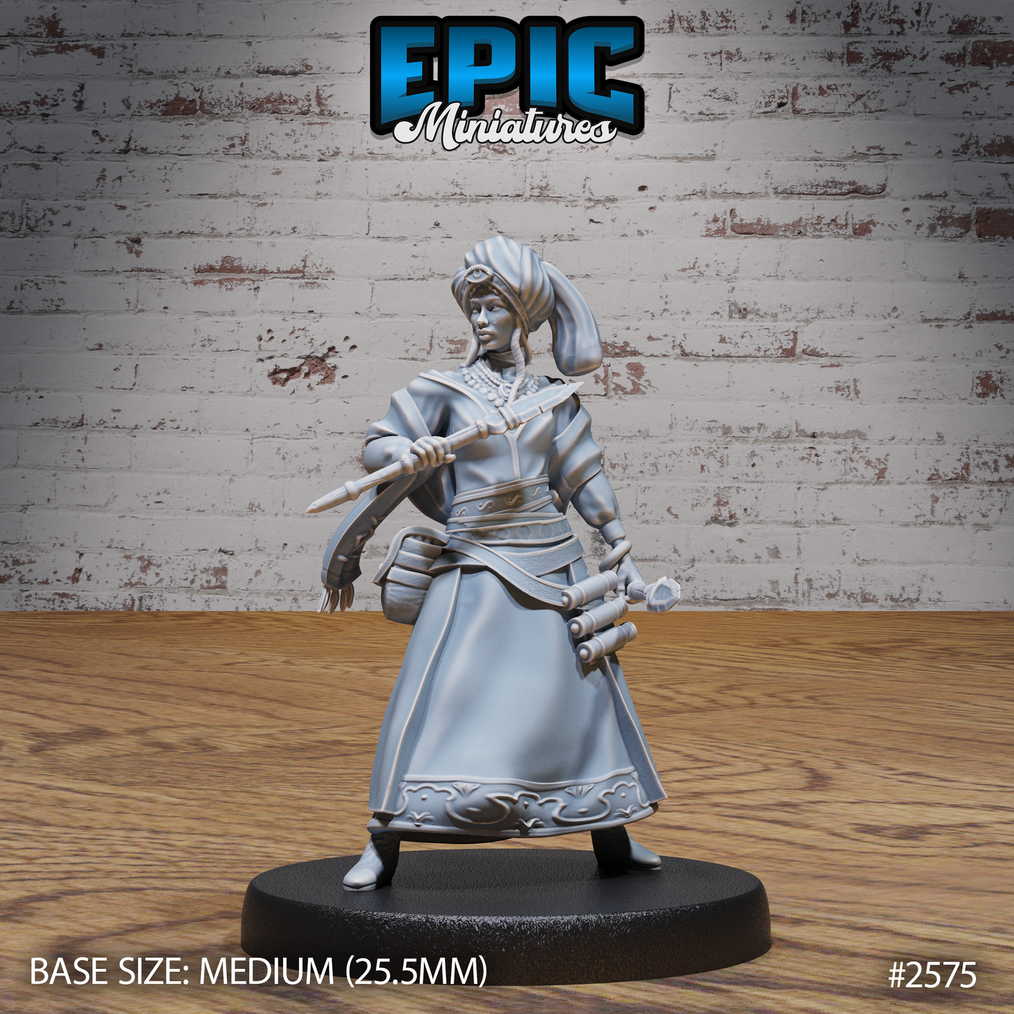 Female tribal seer holding a spear diagonally across her body, wearing a layered robe with embroidered hem trim, a beaded necklace, and a wrapped turban with a third-eye emblem. A flanged mace hangs at her hip. Sculpt by Epic Miniatures.