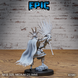 Voodoo Priest Mage miniature by Epic Miniatures shown from behind, revealing a broad sweeping cape with frayed tattered hem, elaborate spiked crown of bones and feathers rising from the skull helmet, and the spirit totem staff held forward in both hands, on a rocky sculpted base.