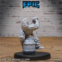 Halfling barmaid seen from behind, tankard raised overhead, showing a wooden barrel base tucked beneath her layered skirts, a rope belt across her back, and voluminous curly hair. Sculpt by Epic Miniatures.
