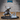 Pumpkin-headed scarecrow mage in a wide witch's hat, hunched in an aggressive spellcasting pose with clawed hands raised, wearing tattered layered robes. Separate icy eruption base piece shown beside it. Epic Miniatures sculpt.