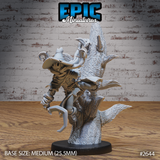 Scarecrow miniature with a carved jack-o'-lantern head and wide-brimmed spiked hat, clinging to a gnarled dead tree with hooked talons and tattered robes, by Epic Miniatures.