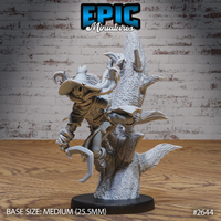 Scarecrow miniature with a carved jack-o'-lantern head and wide-brimmed spiked hat, clinging to a gnarled dead tree with hooked talons and tattered robes, by Epic Miniatures.