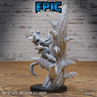 Rear view of the pumpkin scarecrow miniature showing its lean stitched body pressed against deeply textured bark, curved insectile limbs gripping the dead tree trunk, by Epic Miniatures.