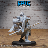 Rotund merchant figure bowing forward under the weight of a huge bundled pack, robes draped heavily, a spear-tipped walking staff visible at his side. Sculpt by Epic Miniatures.