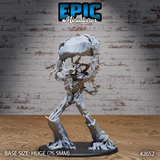 Angry treant miniature striding forward, hoisting a large boulder overhead with both branch-arms, gnarled bark body with expressive face, root-like feet on a large oval base. By Epic Miniatures.