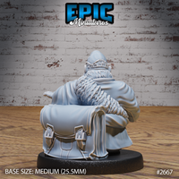 Hamster monk seen from behind, large buckled leather satchel on his back, thick fur across neck and head, voluminous robes spreading to either side. Sculpt by Epic Miniatures.
