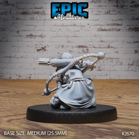 Halfling skin changer seen from behind, crouching with a weighted quarterstaff raised across the body, quiver of arrows clearly visible, heavy cloak and fur collar. Sculpt by Epic Miniatures.