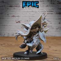 Small cat folk druid facing forward, wearing a tall ornate pointed hat and flowing cloak, raising one clawed hand mid-spell while gripping a staff topped with a bestial totem head and magical flame. Sculpt by Epic Miniatures.