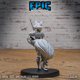 Fennec-eared female warrior seen from behind, showing a voluminous cascading tail and detailed rear armour, spear tip raised above her head, hair falling to her shoulders. Sculpt by Epic Miniatures.