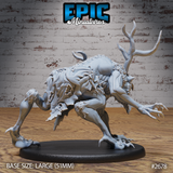 Wendigo miniature by Epic Miniatures viewed from the side, haunches raised, tattered layered fur across the back, single branching antler visible, taloned feet gripping the large oval base, body low and coiled.
