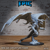 Terror Dragon by Epic Miniatures — winged dragon rearing upright, skull-like horned head angled downward, wings spread wide with ribbed membranes, serrated spike-ridged tail, on a rocky scenic base.