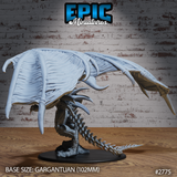 Terror Dragon by Epic Miniatures — viewed from the side with both wings fully extended overhead, body low and coiled, hooked bone spurs along wing edges clearly visible, serrated tail trailing behind.
