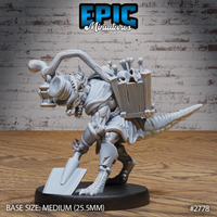Kobold Gravekeeper by Epic Miniatures, leaning forward with a flat-bladed shovel in one hand, wearing a stitched ragged cloak, scaled hide and ridged tail visible, large wooden crate packed with bones and skulls strapped to back.