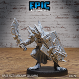 Armoured kobold warrior in a low crouch, holding a serrated short blade raised to strike and bracing a large riveted slab shield. Horned helm, spiked pauldrons, layered plate armour. Sculpt by Epic Miniatures.