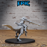 Rear three-quarter view of a dragonborn raptor rider, showing layered scale-pattern back armour, saddle tack detail, and the raptor's feathered tail and taloned feet gripping the ground mid-stride. Large round base. Epic Miniatures.