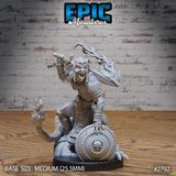 Snarling kobold champion gripping a rune-etched sword overhead, flame-wreathed clawed hands, skull pauldron, chainmail chest, kneeling atop a skull-motif shield. Sculpt by Epic Miniatures.