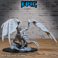 Dragon miniature viewed from behind with both wings fully spread wide, hooked wingtips prominent, ridged spine and segmented tail visible, crouching over a shattered rock scenic base. By Epic Miniatures.