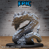 Serpent beast miniature coiled tightly with fanged jaws agape, bristling fur mane, textured overlapping scales, and a base scattered with skeletal remains and bones. Sculpt by Epic Miniatures.